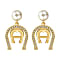 Earrings with horseshoe and pearl gold